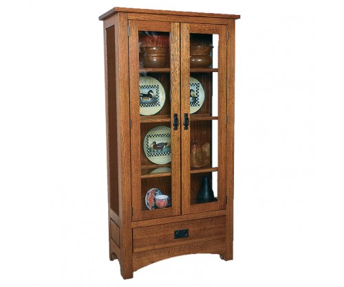 Classic light stained wooden cabinet with glass door and plates on the shelves inside the doors