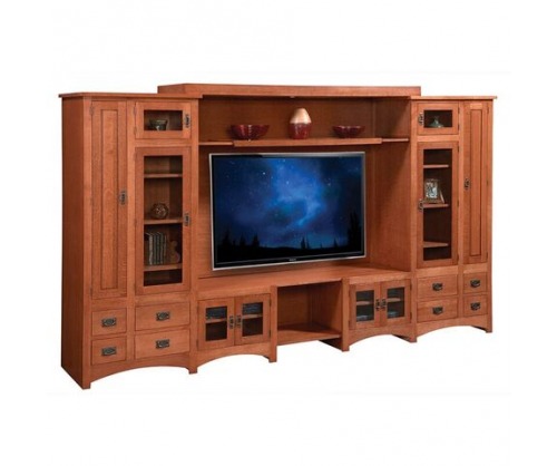 Light stained wooden entertainment center with shelves, drawers and cabinets on each side of the TV placement area
