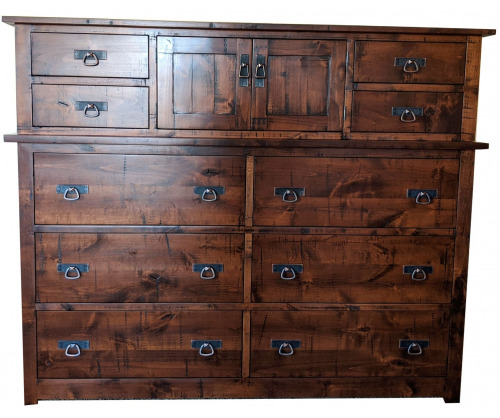 Large wooden chest with a dark stain, black hardware and 4 smaller drawers on top with 6 larger drawers on bottom