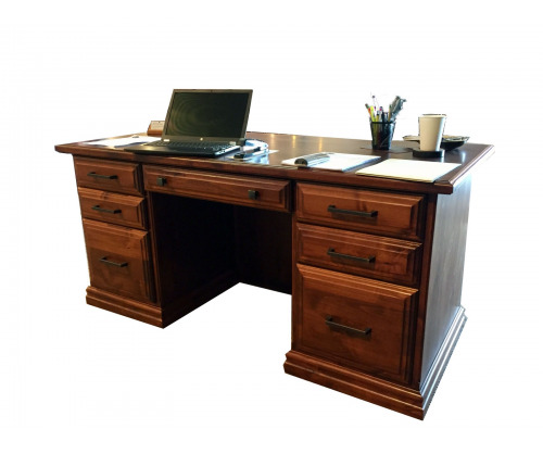 Executive desk with a laptop and papers on top