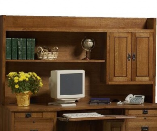 Classic desk hutch with 1990s computer sitting on top, keyboard drawer and books on the upper shelves