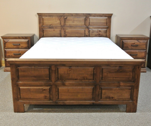 Wooden panel bed with a mattress and nightstands on each side